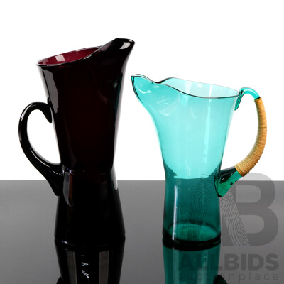 Two Mid Century Coloured Glass Pitchers with Pinched Waists