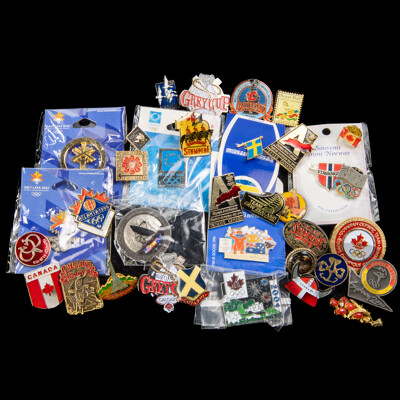 Collection of Vintage Olympic Souvenir Pins with Other Vintage Travel Pins